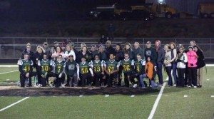 Courtesy photo The seniors for the 2015 Eureka County High football team gather at halftime with their parents and loved ones for Senior Appreciation Night last Friday. Eureka defeated Owyhee 86-16 to finish the regular season 8-0. The Vandals will get another game on their home turf when they host Virginia City in the regional playoffs next Friday at 7 p.m.