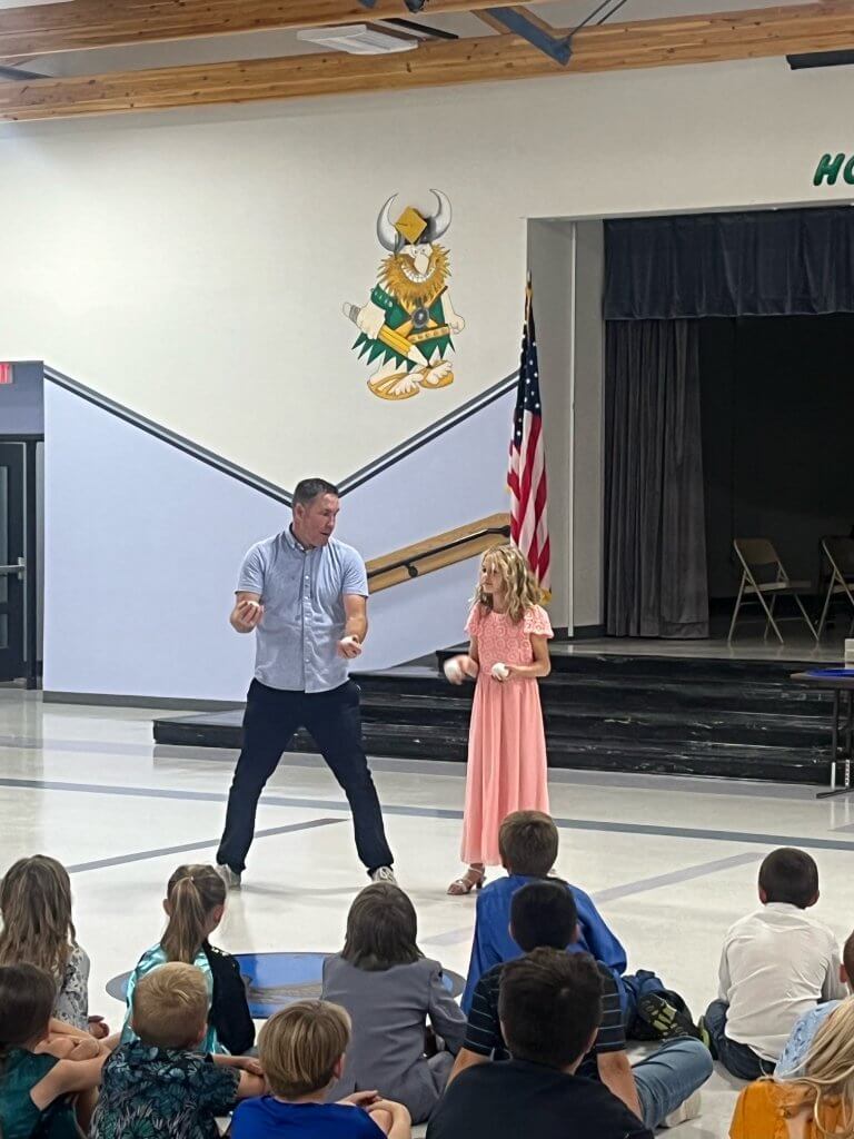 CAPTION
Juggler Dana Adams works with a student during a Red Ribbon Week assembly.